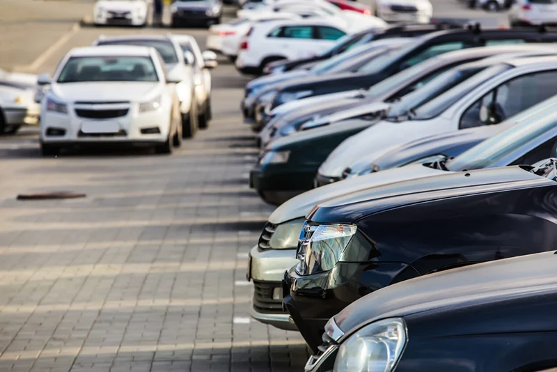 Rows of used cars, trucks and SUVs parked in a lot, cash for cars in Downtown Toronto, Ontario